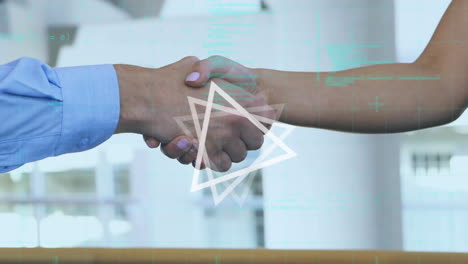 animation of moving geometrical shapes and data processing over people shaking hands