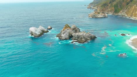 big sur coastal rocks | california | aerial flyby | clear water