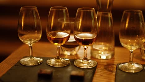 a whisky tasting session with multiple glasses