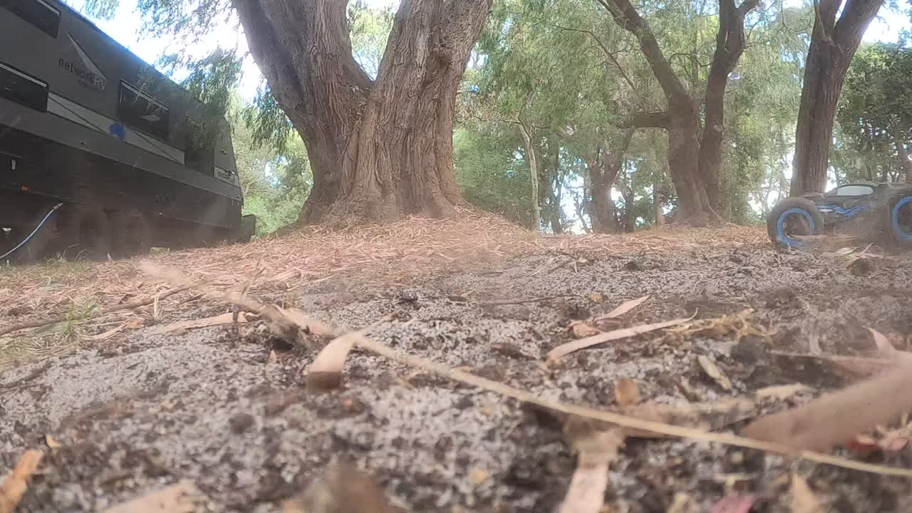 remote controlled monster truck spraying dirt at camera SLOW MOTION