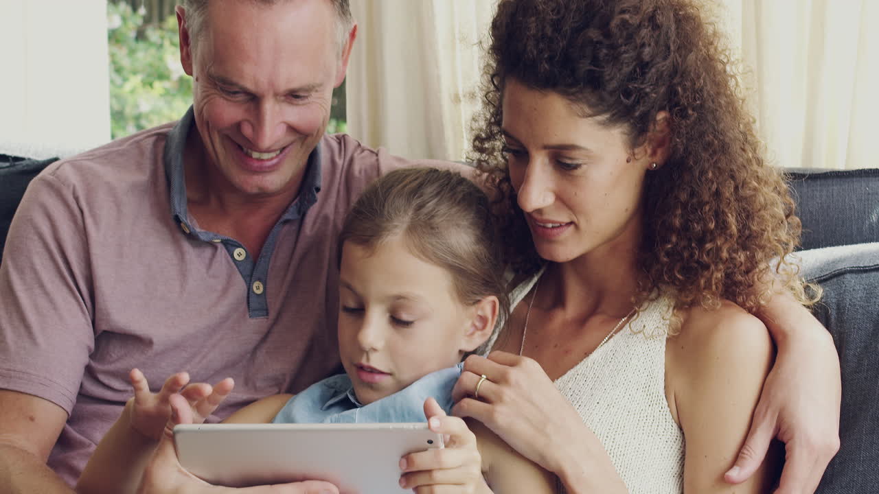 Family enjoying time together using tablet