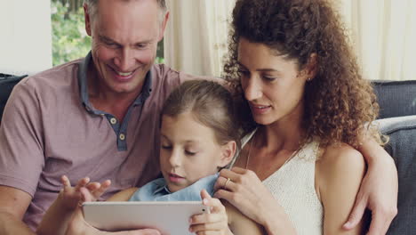 family enjoying time together using tablet