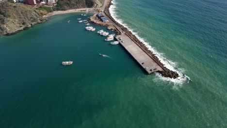 Panning-from-left-to-right-with-an-aerial-drone-shot-of-the-coast-of-Porlamar,-located-in-Margarita-Island-in-the-country-of-Venezuela