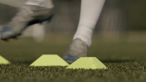 close shot of a soccer player dribbling the ball around in super slow motion