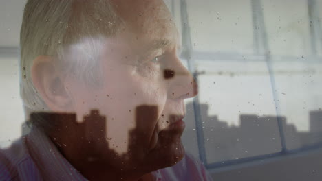 animation of cityscape over sad senior caucasian man