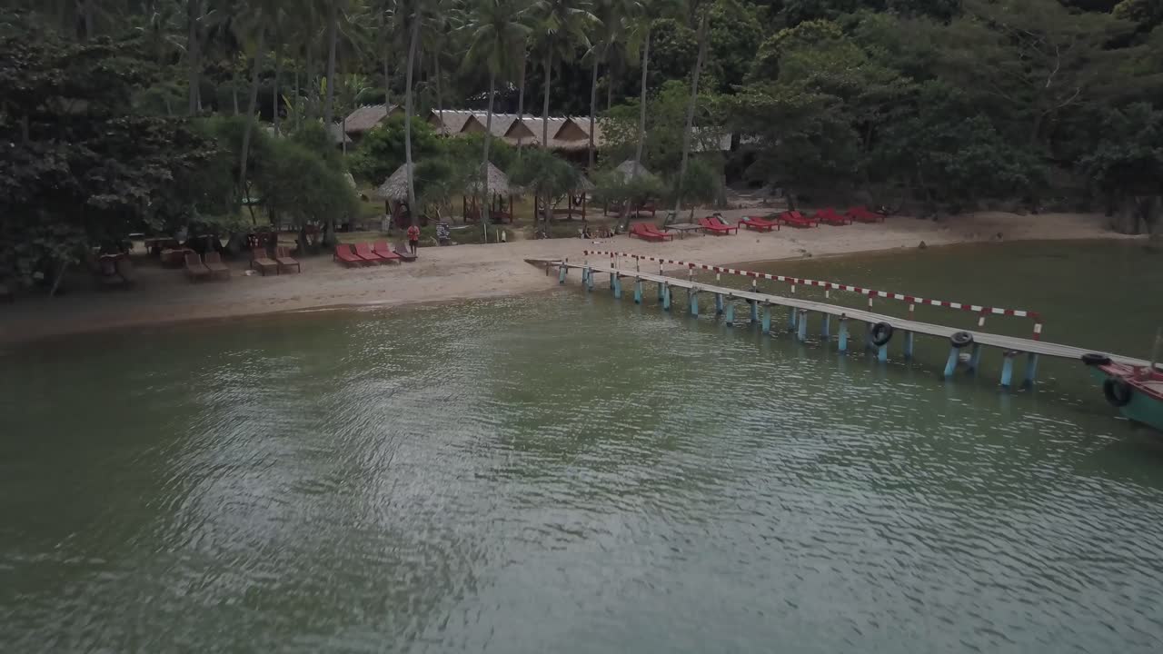 Tropical Beach with Pier and Boat