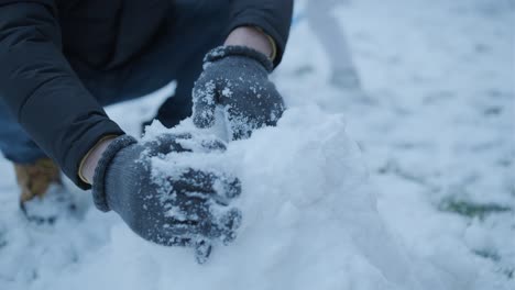 grandfather and granddaughter having fun in the snow