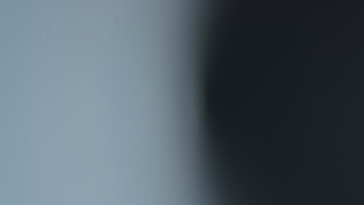 Abstract light leaks on black background.