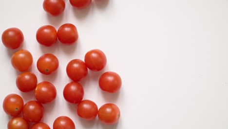 red juicy chili tomatoes on a white background roll out. empty space for text