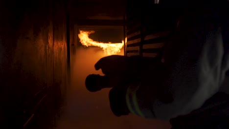 slow motion view of fire in building and smoky hallway