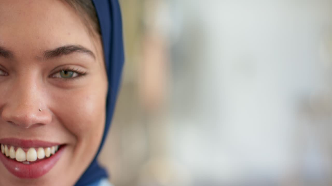 Indian woman speaking in hijab after camera focus, engaging viewer at home, copy space