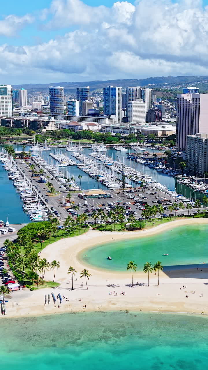 Honolulu, Hawaii USA, Vertical Drone Shot of Ala Wai Harbor Marina, Lagoon and Beachfront Towers