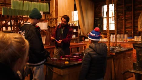 candle making demonstration at a historical museum