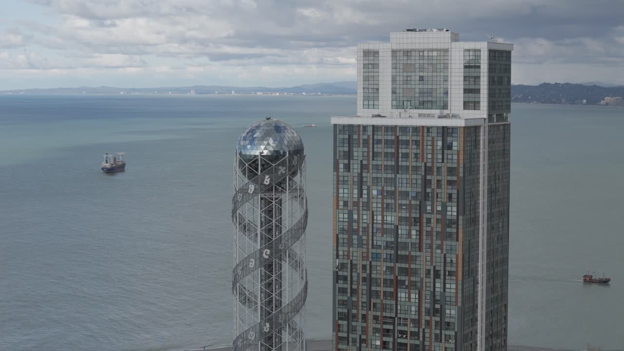 Cinematic daytime drone footage of Batumi skyline and skyscrapers.