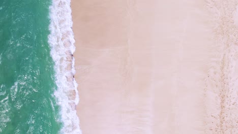 waves crashing on beach, abstract vacation background, aerial top down view