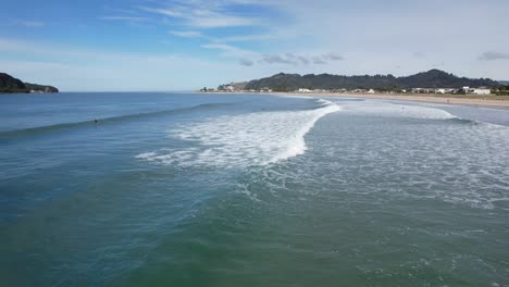 Surfers-On-Whangamata-Beach-Near-Whangamata-Town-In-Coromandel-Peninsula,-North-Island-Of-New-Zealand