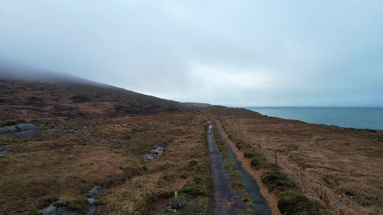 drone flying over a rural lane on remote mountain in Sheeps head West Cork Ireland Epic Locations in winter