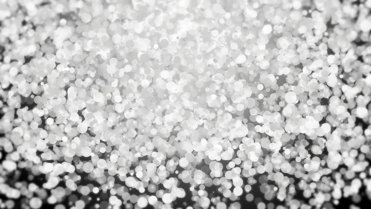 Silver falling glitter, shiny confetti with glowing sparkles, shimmer spray effect, festive holiday particles. Loop animation.