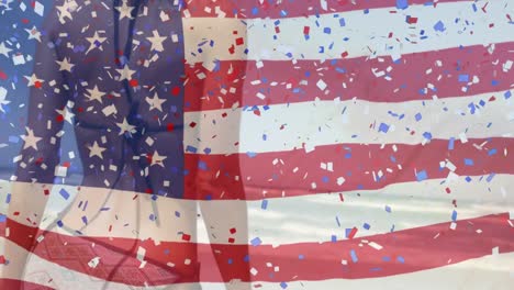 Animation-of-american-flag-and-confetti-over-caucasian-woman-at-beach