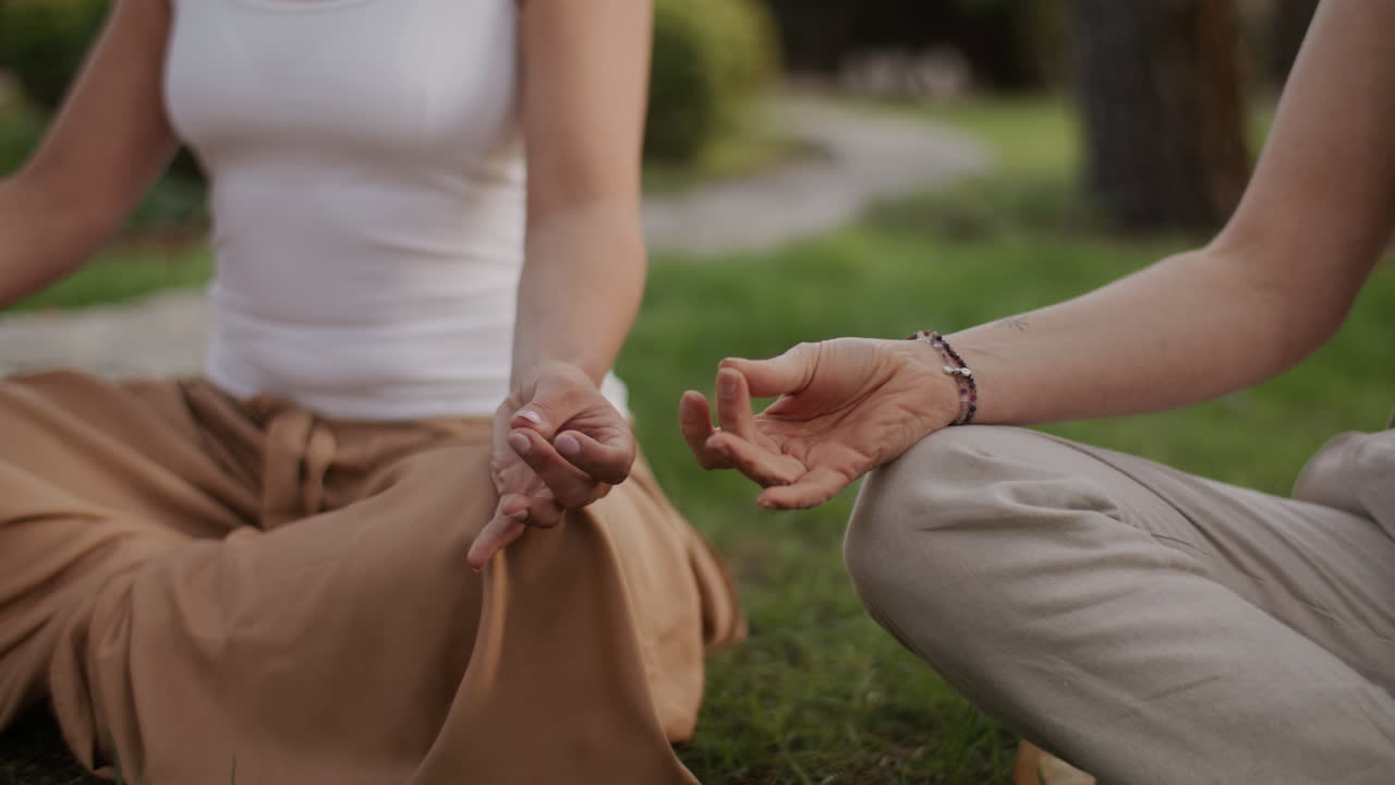 Women Meditating Outdoors