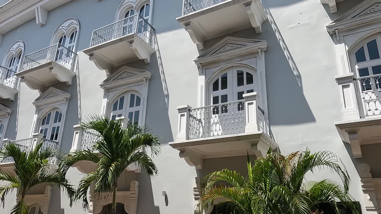 Old Building in Casco Viejo, Panama City Old Town. Facade and Palm Trees. Walking POV