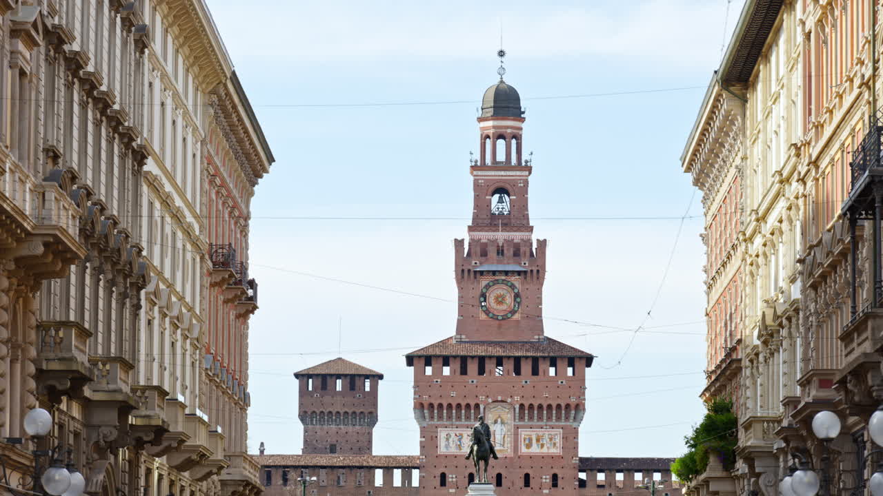 View of the Filarete Tower between buildings in Milan, Italy in daylight