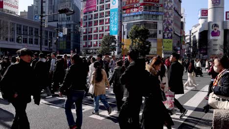 pedestrians crossing a busy urban intersection