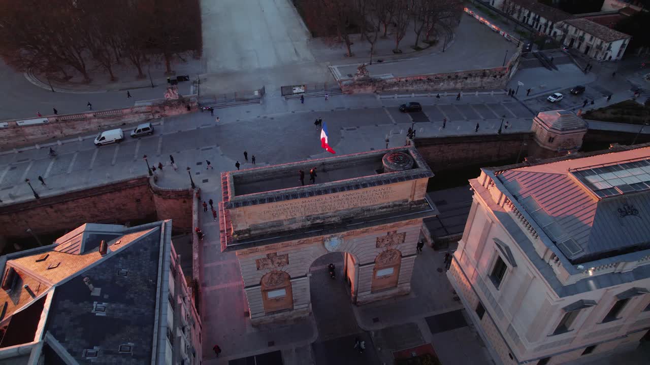 Two men singing on top of Arc de triomphe Montpellier