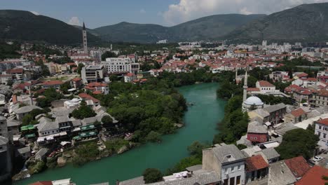 drone view of mostar bridge in the balkans, historical bridge built over the river