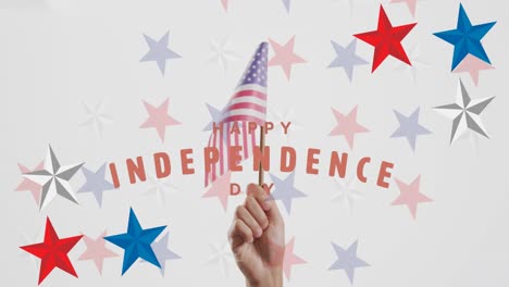 animation of happy independence day text and stars over hand holding flag of america