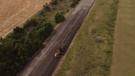 leveling of sand and gravel during countryside road construction