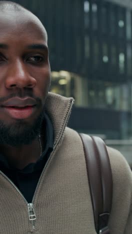 man walking in city