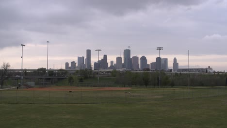 Drone-view-of-downtown-Houston,-Texas-from-neighborhood-park