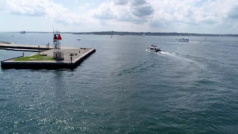 conic-Newport-Rhode-Island-scenery-is-enjoyed-by-a-boat-load-of-tourists-near-Ft