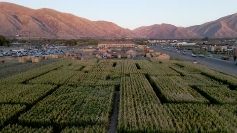 Corn-Maze-at-Fun-Festival-in-October-Halloween---Fall-Season,-4k-Aerial-Drone-Flying-View