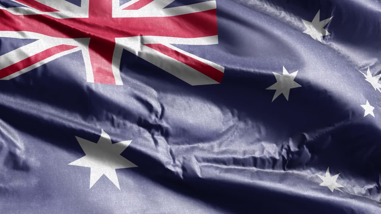 bandera textil de australia agitando lentamente en el bucle del viento. bandera australiana balanceándose suavemente en la brisa. tejido textil de tela. fondo de relleno completo. bucle de 20 segundos.