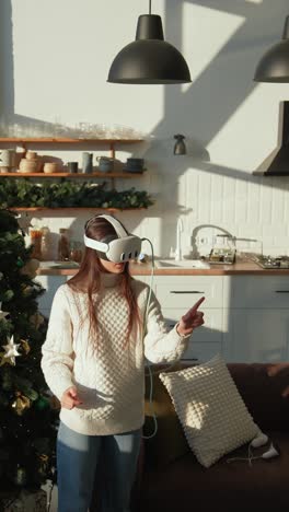 woman wearing vr headset in a christmas kitchen