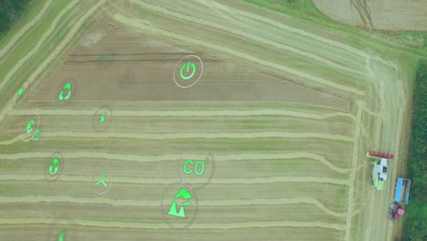digital agriculture animating over tractor pulling trailer with farmers and floating green icons