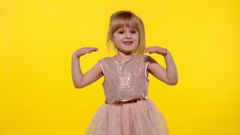 kid girl looking at camera crossed hands showing stop gesture on yellow background. slow motion