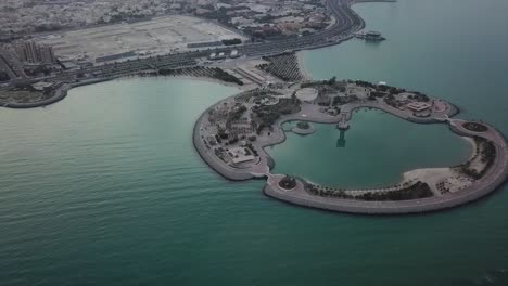 kuwait’s artificial green island. slow pan aerial shot