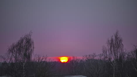 inspiring red sunset bellow grey cloudscape, rural landscape, fusion time lapse