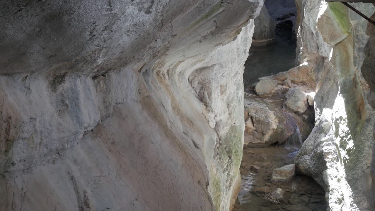 Rocky canyon with flowing water in Desfiladero de Yecla, natural park in Burgos