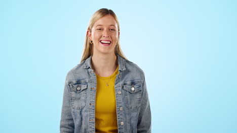 Young,-woman-and-laugh-with-happiness-in-studio