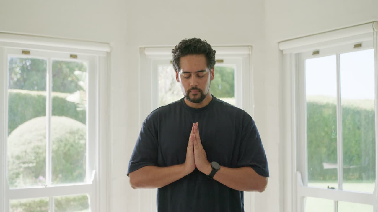 African American man starting inhale bringing palms, breathing to relax in bay with watch strips