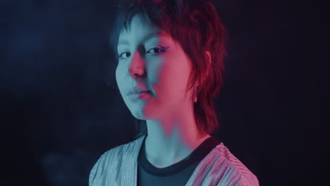 neon portrait of a woman smoking vape