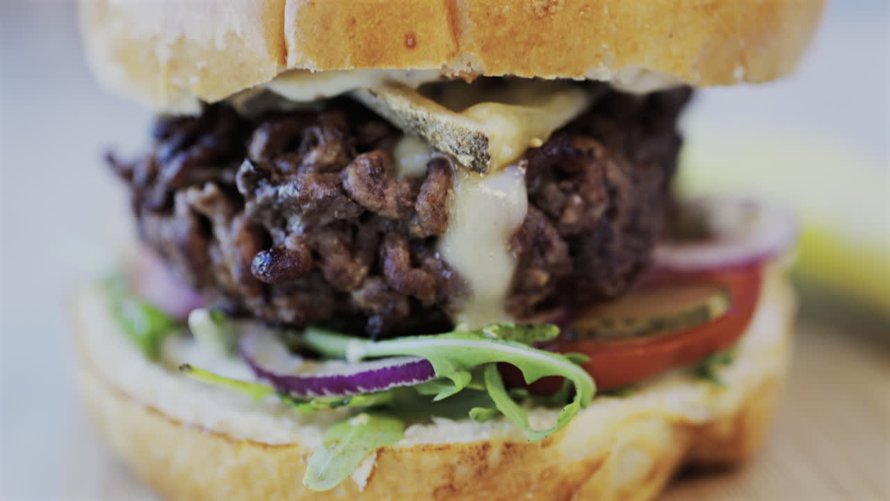 Close up of a hamburger on a plate at a restaurant
