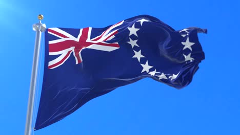 flag of the cook islands waving at wind with blue sky, loop