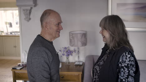 elderly man assisted by caregiver at home