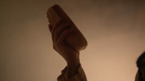 hand holding bread