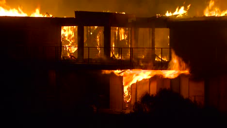 close up of a home burning in a large inferno at night during the 2017 thomas fire in ventura county california 4